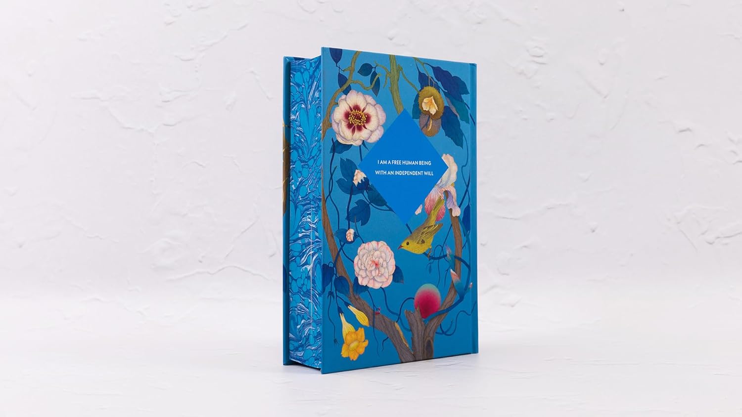 Decorative notebook with floral design on a white background