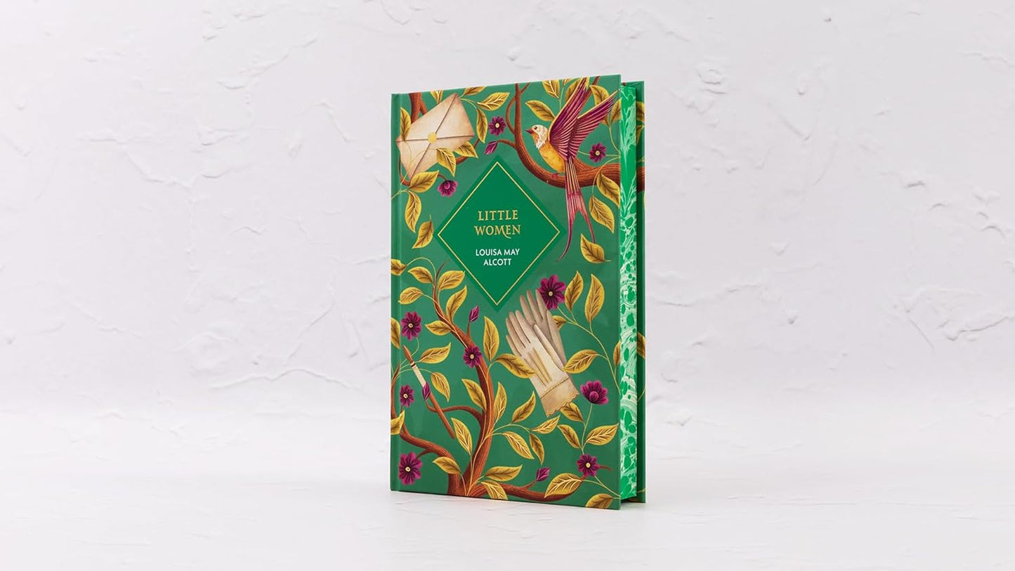 Decorative book with a green cover featuring floral and bird designs on a white background