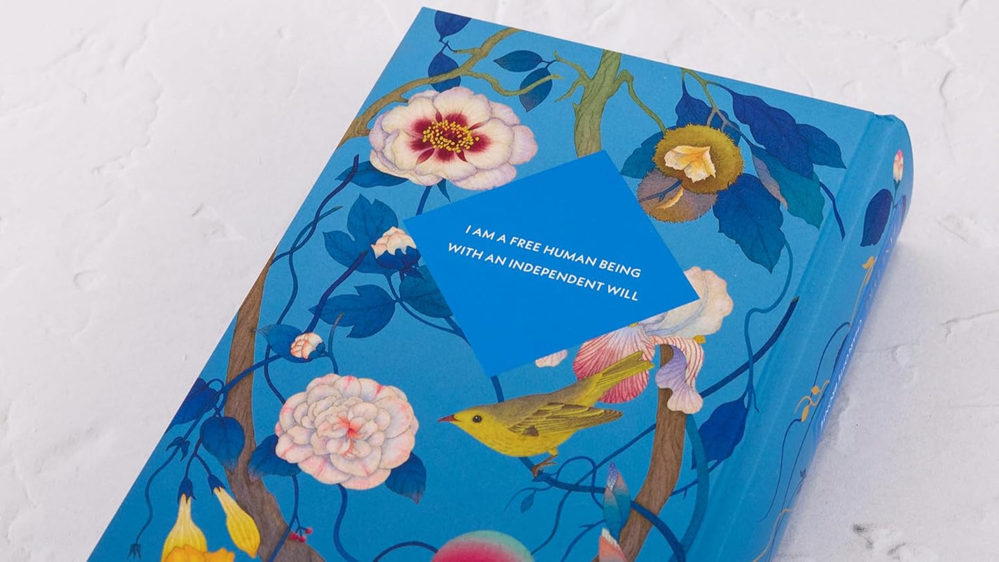 Blue book with floral design and text on a white background