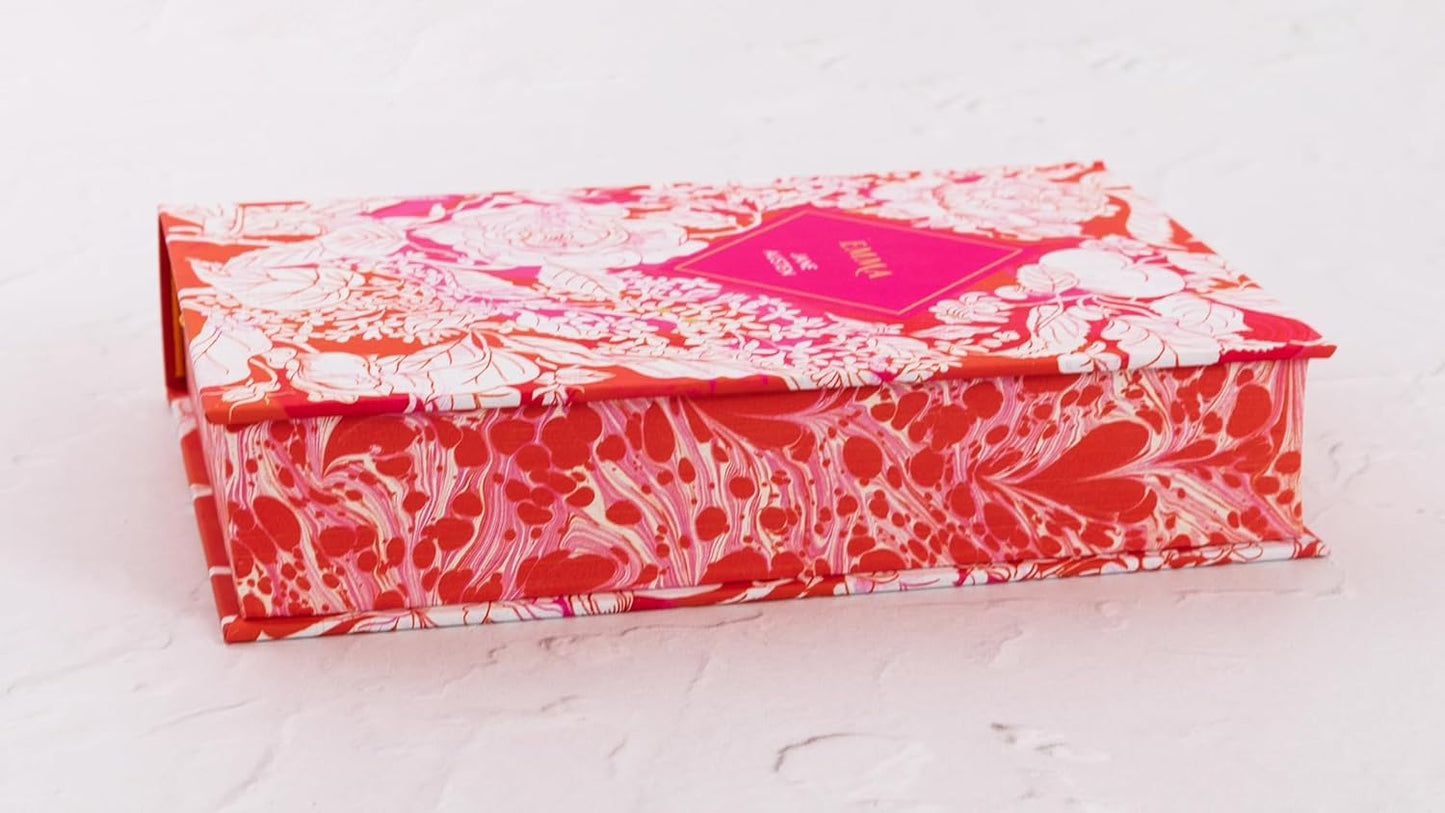 Decorative box with red and white floral pattern on a light gray background