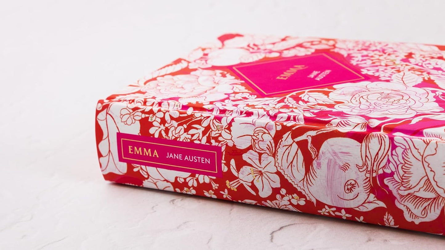 Book titled 'Emma' by Jane Austen with a red and white floral design on the cover.