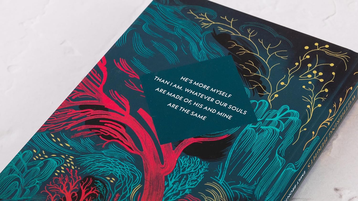 Book with colorful design and text on a white surface