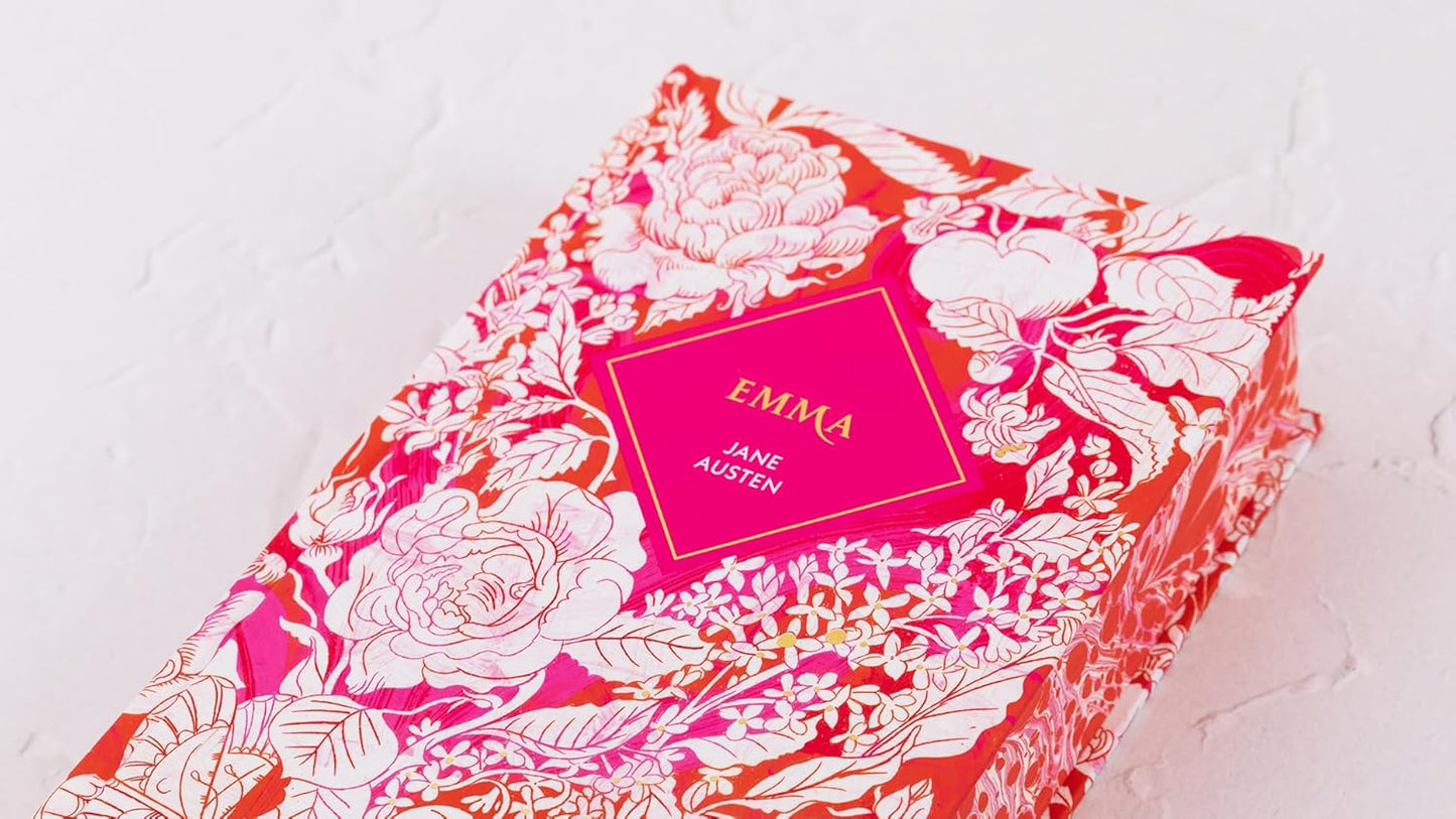 Book titled 'Emma' by Jane Austen with floral cover design on a light background
