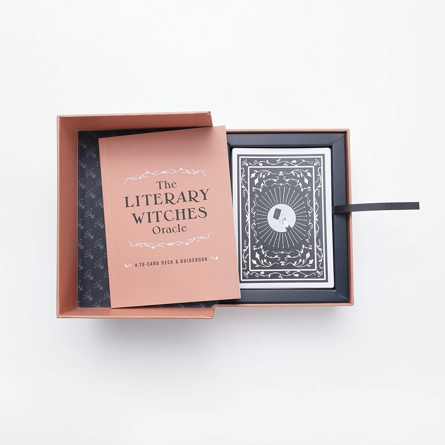 The Literary Witches Oracle set with rose gold box and black deck on a white background